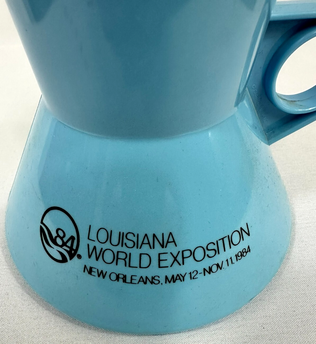 1984 Louisiana World Exposition New Orleans Light Blue Plastic Sitting Cup
